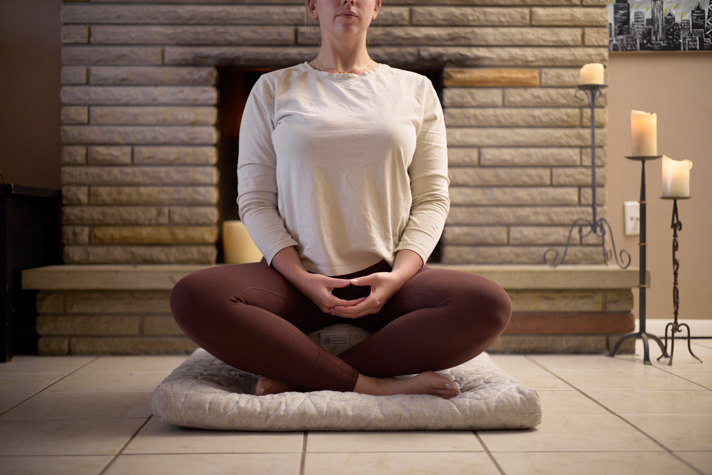 woman meditating on zafu front view