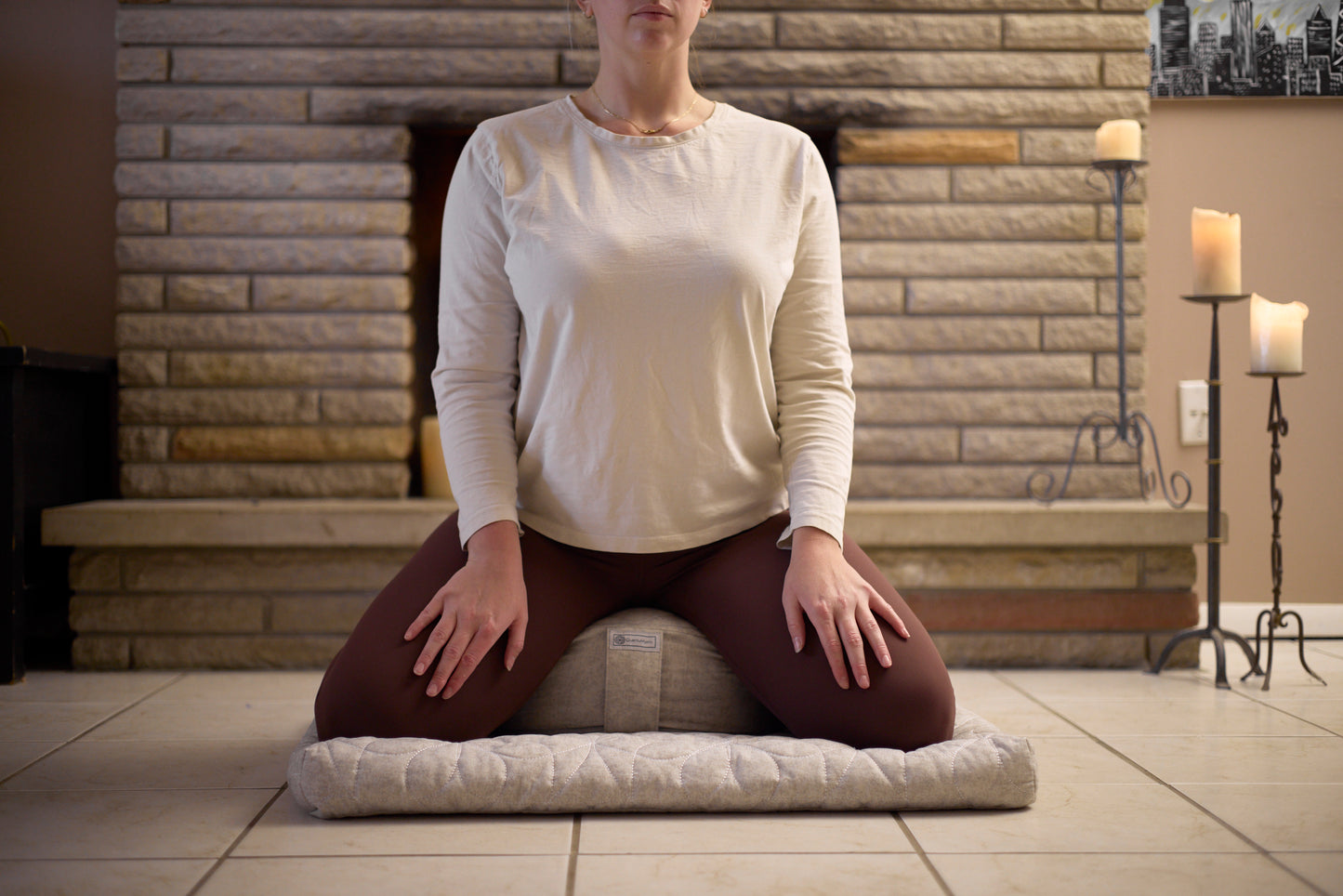 woman meditating on zafu front view